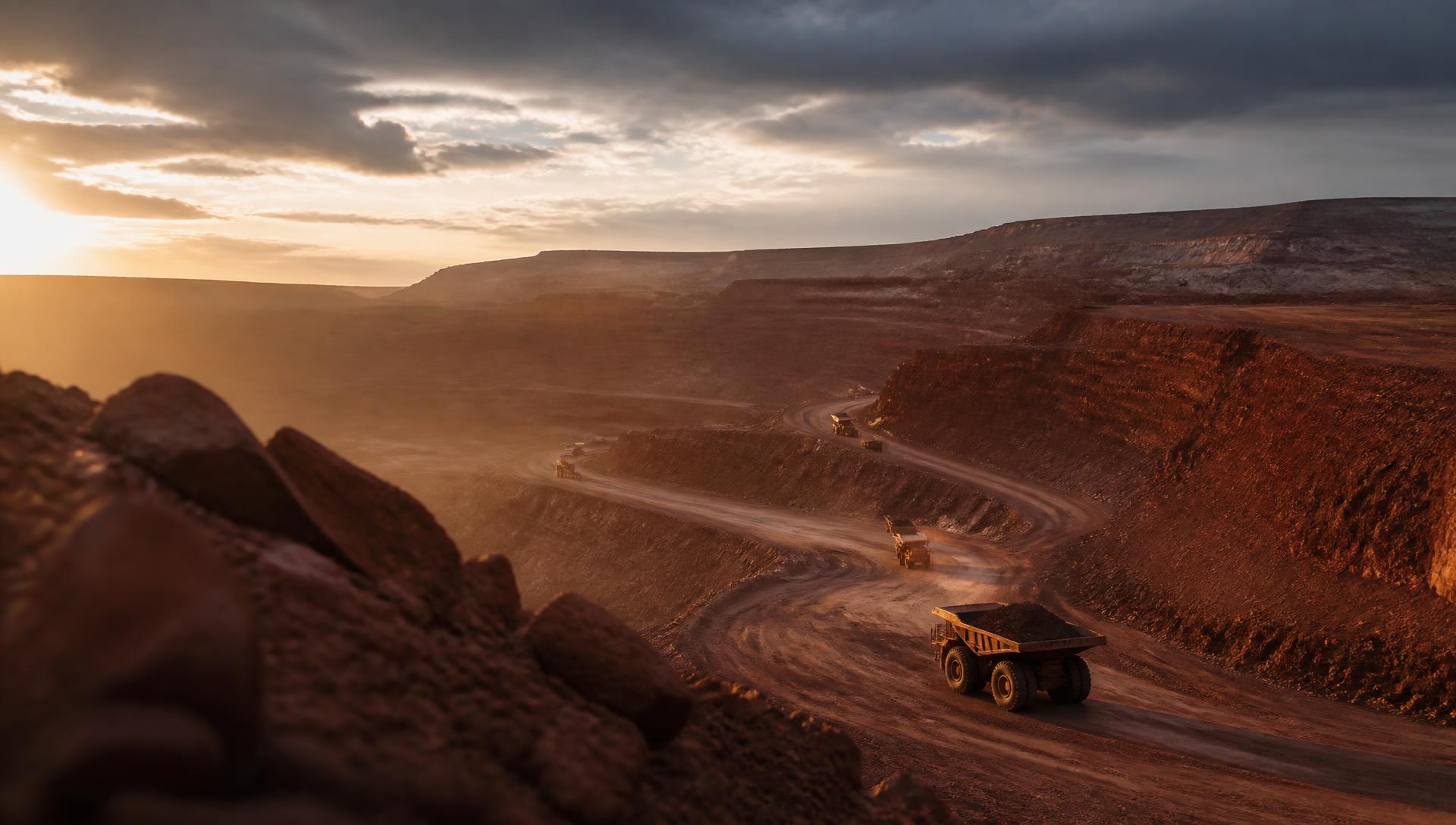 Open-pit mining development site at golden hour